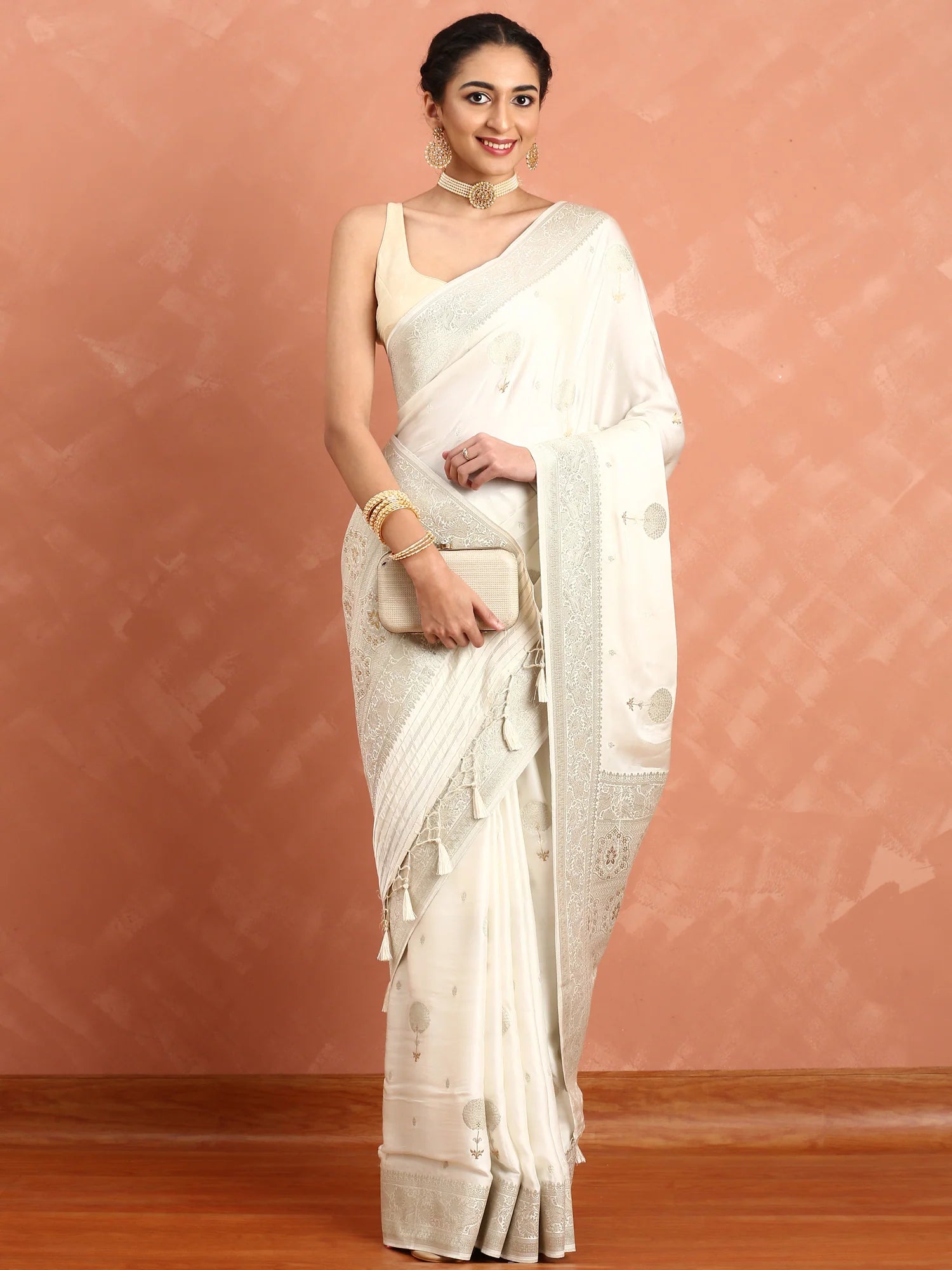 White Banaras silk saree with zari motifs and border